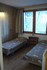 la chambre avec deux lits de l'appartement de La Cachette à louer à Valmorel